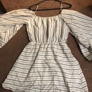 A white and black of the shoulder dress